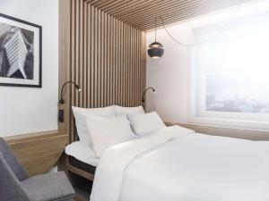 Postel nebo postele na pokoji v ubytování Radisson Blu Hotel Tromsø