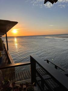a view of the ocean at sunset from a boat at Casa Marambaia in Rio de Janeiro