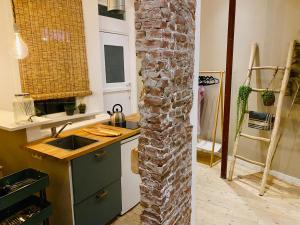 Kuchyň nebo kuchyňský kout v ubytování Tiny Beachhouse