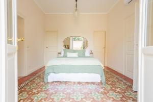 a bedroom with a bed and a large rug at PALAZZO SABBIONI CAMERA ROMANTICA della DUCHESSA in Ferrara