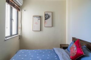 Letto o letti in una camera di Guanlan Pavilion Seaview Homestay