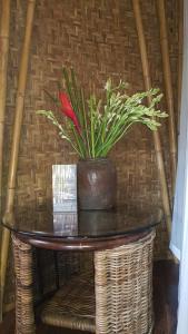a table with a potted plant on top of it at Geopark Village & Spa in Kintamani