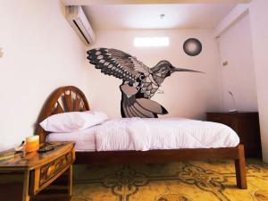 Cama o camas de una habitación en Hostal Mirada al Mar