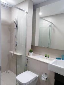 a bathroom with a shower and a toilet and a sink at The Ridge @ KL East Mall & Condominium in Kuala Lumpur