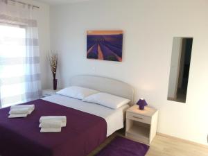 Postel nebo postele na pokoji v ubytování Apartments Levanat