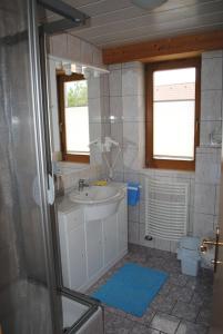 a bathroom with a sink and a toilet at Ferienwohnung Martha in Obsteig