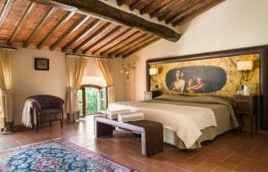 Voodi või voodid majutusasutuse Villa Campomaggio Resort & SPA toas