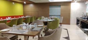 A restaurant or other place to eat at Elora Lords Eco Inn , Lucknow