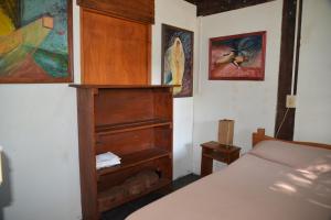 En eller flere senge i et værelse på Cabañas Gesell