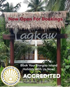 een nieuwe open voor boeken bord voor een gebouw bij Lagkaw Siargao Villas in General Luna