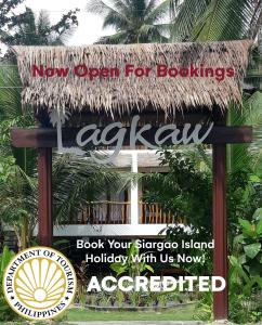 a new open for books sign in front of a building at Lagkaw Siargao Villas in General Luna