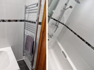 a bathroom with a shower and a toilet and a tub at Bank Top in Earl Sterndale