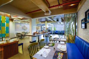 A restaurant or other place to eat at Amoravida By 7 Apple Resorts, Goa
