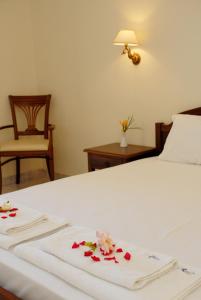 Rúm í herbergi á Aphrodite Hotel