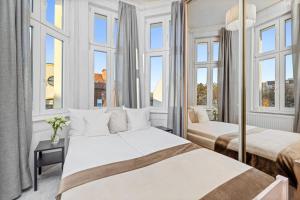 Posteľ alebo postele v izbe v ubytovaní Riviera Residence Apartments