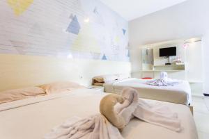 Voodi või voodid majutusasutuse Batuque Town Villa toas