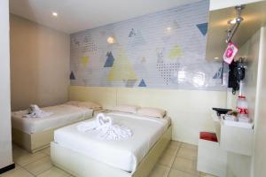 Voodi või voodid majutusasutuse Batuque Town Villa toas