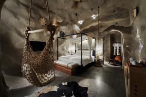 a bedroom with a bed and swings in it at Moonlo Hotel - Pet Friendly - Pudong Airport & Disney Free Shuttle Bus in Shanghai