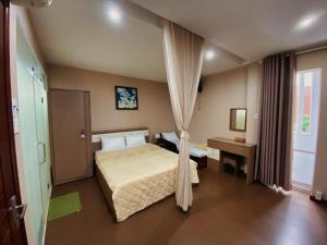 Кровать или кровати в номере Little Home Nha Trang Apartment