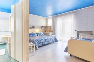 Postel nebo postele na pokoji v ubytování HOTEL Villa Lilla