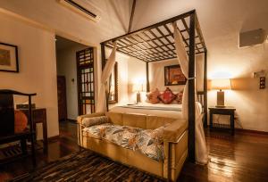 
A bed or beds in a room at Hotel Penaga
