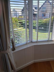 a window with a view of a building at The Slopes in Whitstable