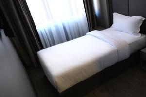 Postel nebo postele na pokoji v ubytování Dilens Bosphorus Hotel