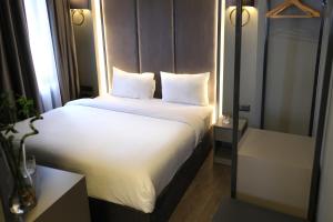 Postel nebo postele na pokoji v ubytování Dilens Bosphorus Hotel + 37 fotografií