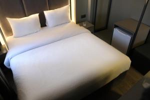 Postel nebo postele na pokoji v ubytování Dilens Bosphorus Hotel