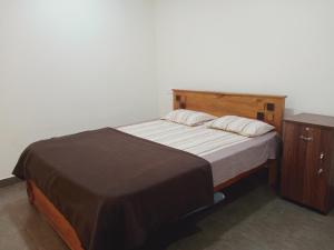 מיטה או מיטות בחדר ב-Wayanad Cocos Villa