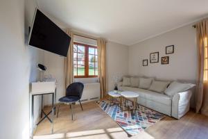 Televízia a/alebo spoločenská miestnosť v ubytovaní Plitvice Village