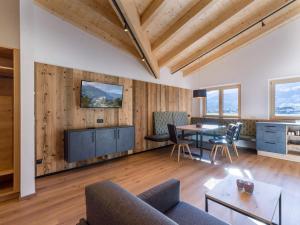 a living room with a couch and a table at Baderer Apart in Stumm