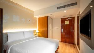 ibis Mumbai Airport - An Accor Brand客房内的一张或多张床位