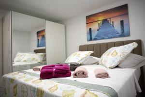 Postel nebo postele na pokoji v ubytování Pearl Apartment