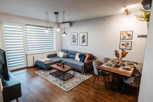 a living room with a couch and a table at AH Radnica IV in Košice