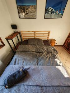 En eller flere senge i et værelse på Tatratour. Apartament u Przewodników.