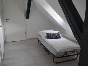 Postel nebo postele na pokoji v ubytování Bugenhagen - Classic Appartements