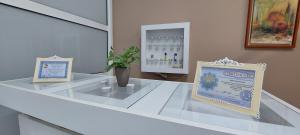 a glass counter with two signs on top of it at Spa Resort Luxury Apartments in Budva