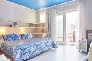 Postel nebo postele na pokoji v ubytování HOTEL Villa Lilla