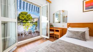 Postel nebo postele na pokoji v ubytování Hotel Splendid + 37 fotografií