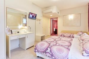 Postel nebo postele na pokoji v ubytování HOTEL Villa Lilla