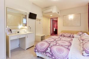 Postel nebo postele na pokoji v ubytování HOTEL Villa Lilla
