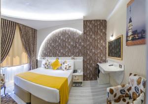 Postel nebo postele na pokoji v ubytování Dündar Hotel
