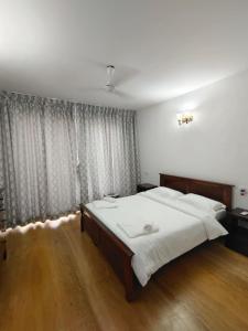 Ένα ή περισσότερα κρεβάτια σε δωμάτιο στο VILLA M - JIA 3 CANDOLIM GOA 3BHK, Pool Facing, Near Beach, Free Breakfast, Free WIFI and Prime Location