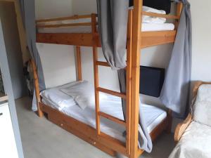 a couple of bunk beds in a room at Jolie studio au coeur d'Allos in Allos