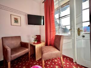 TV a/nebo společenská místnost v ubytování Hotel Restaurant Grünwalderhof