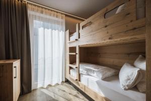 A bed or beds in a room at AhriaPura