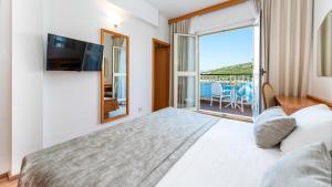 Ein Bett oder Betten in einem Zimmer der Unterkunft Hotel Splendid