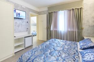 Postel nebo postele na pokoji v ubytování HOTEL Villa Lilla
