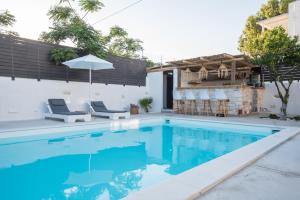 The swimming pool at or close to Rivière Residence Paros
